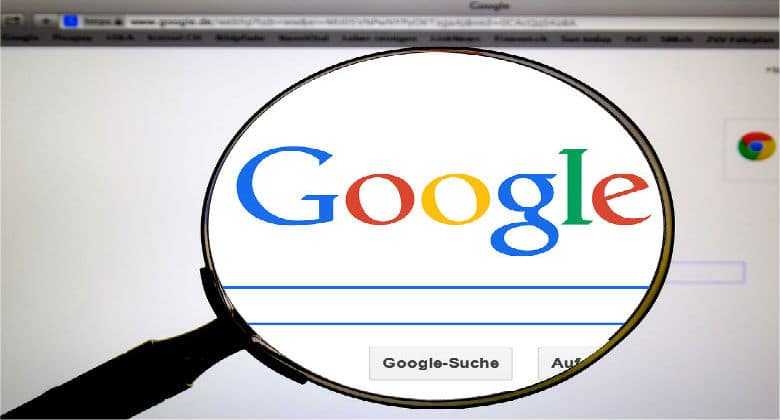 Google logo through a magnifying glass