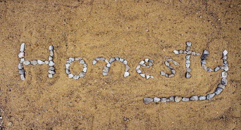 Honesty spelled out in rocks on a beach